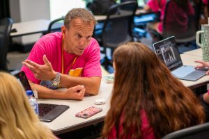 Adviser, Aaron Manfull, instructing students