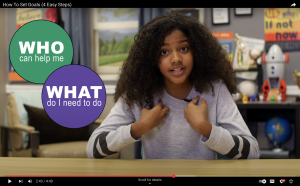 Screenshot of a girl from a youtube video. Two text bubbles are to her left.